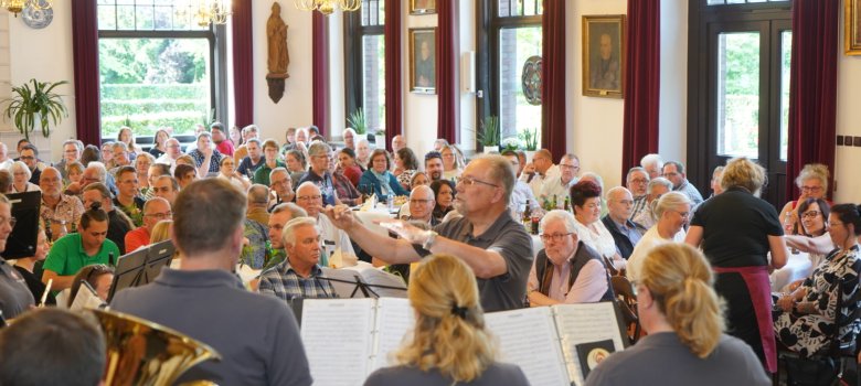 People listening to an orchestra.